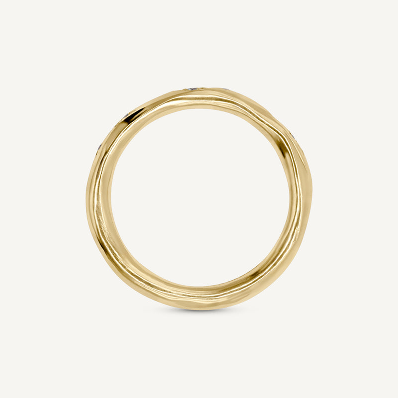 A lightly textured band with clusters of ethically sourced diamonds. Made from 100% recycled solid 14ct gold, this wedding ring is modern yet timeless and is handmade by Robyn in her South London jewellery studio.