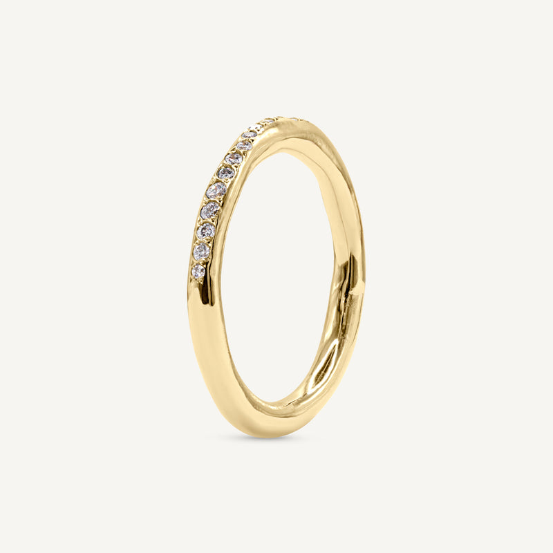 A modern and playful eternity ring set with diamonds half way around the band. 100% recycled solid 14ct gold and ethically sourced gemstones. Handmade by South London jeweller Robyn in her studio.