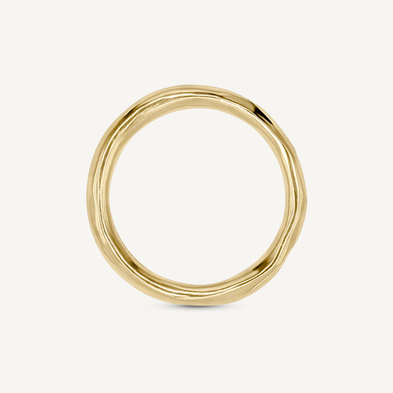 Solid 14ct yellow gold plain wedding ring with a classic timeless design. Inspired by hand-forged rings, this textured minimalistic band has a smooth polished finish. Unisex ring handmade in South London using 100% recycled gold.