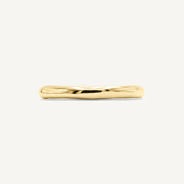Solid 14ct yellow gold plain wedding ring with a classic timeless design. Inspired by hand-forged rings, this textured minimalistic band has a smooth polished finish. Unisex ring handmade in South London using 100% reccyled gold.