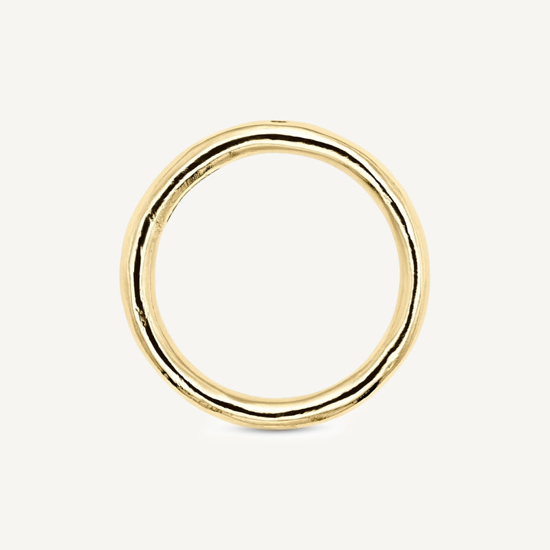 A solid 14ct yellow gold wedding band handmade in South London using 100% recycled precious metals. Unisex design featuring an ethically sourced champagne diamond for added sparkle.