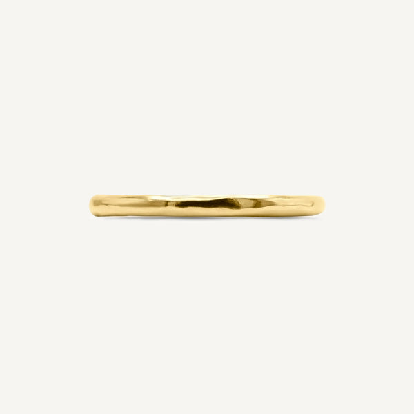 A subtle textured thin wedding ring is handmade from 100% recycled solid 14ct yellow gold, a timeless wedding ring choice. Made by South London jeweller Robyn Smith