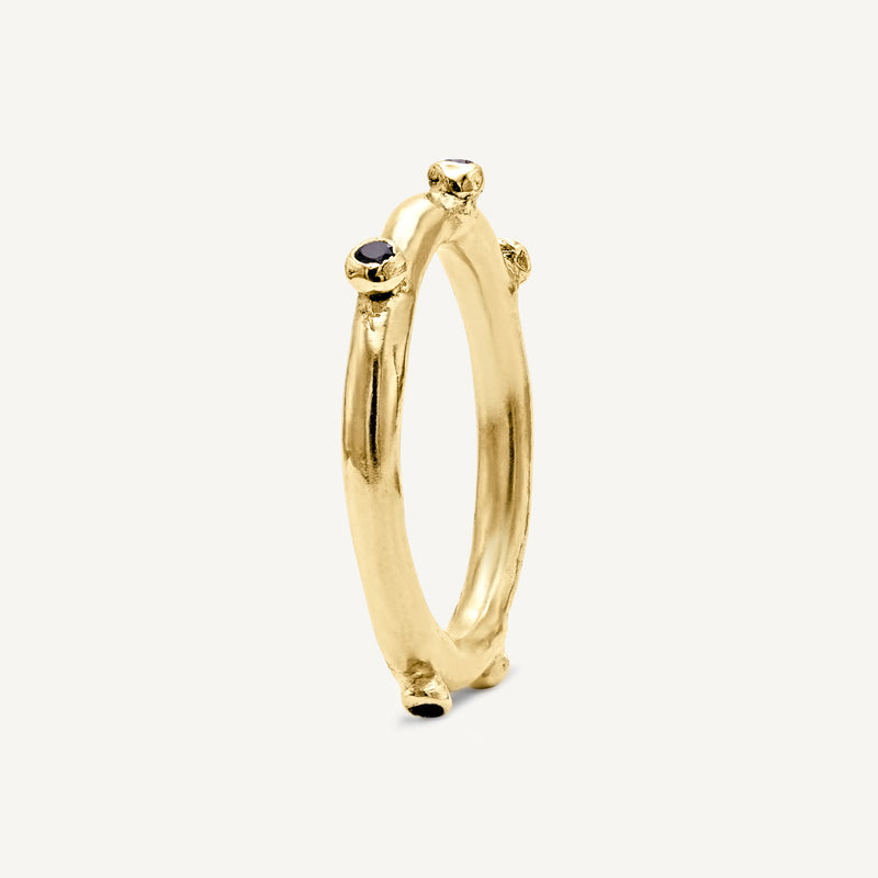 Unique and playful, this solid 14ct gold bobble ring is set with ethically sourced diamonds and tourmaline gemstones. Handmade in South London using 100% recycled precious metal.