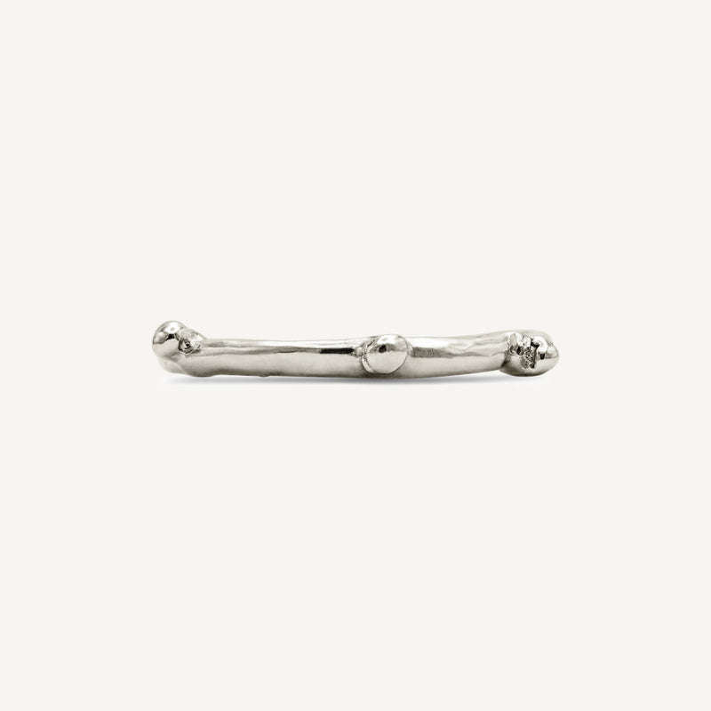 Rough, textured, alternative solid 14ct white gold stacking bobble ring with a polished surface. Hadmade in Robyn's South London workshop using 100% recycled gold.