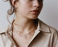 The ISAMU earrings and JOAN necklace, from the collection Edition 08 made in collaboration with Birgit Toke Tauka Frietman. Ethically handmade in London using recycled silver.