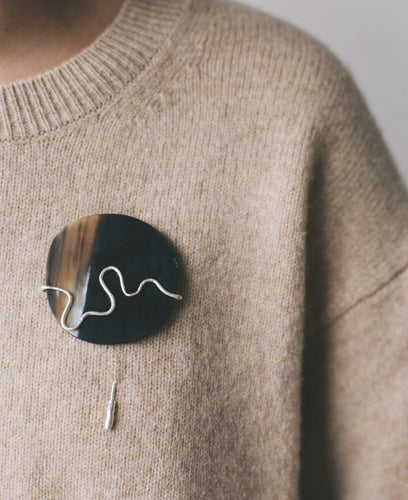 The DREW brooch, from the collection Edition 08 made in collaboration with Birgit Toke Tauka Frietman. Ethically handmade in London using recycled silver and pressed horn. 