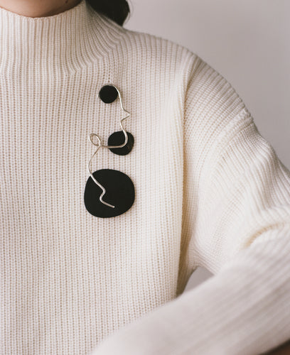 The NICOLAS brooch, from the collection Edition 08 made in collaboration with Birgit Toke Tauka Frietman. Ethically handmade in London using recycled silver and pressed horn.