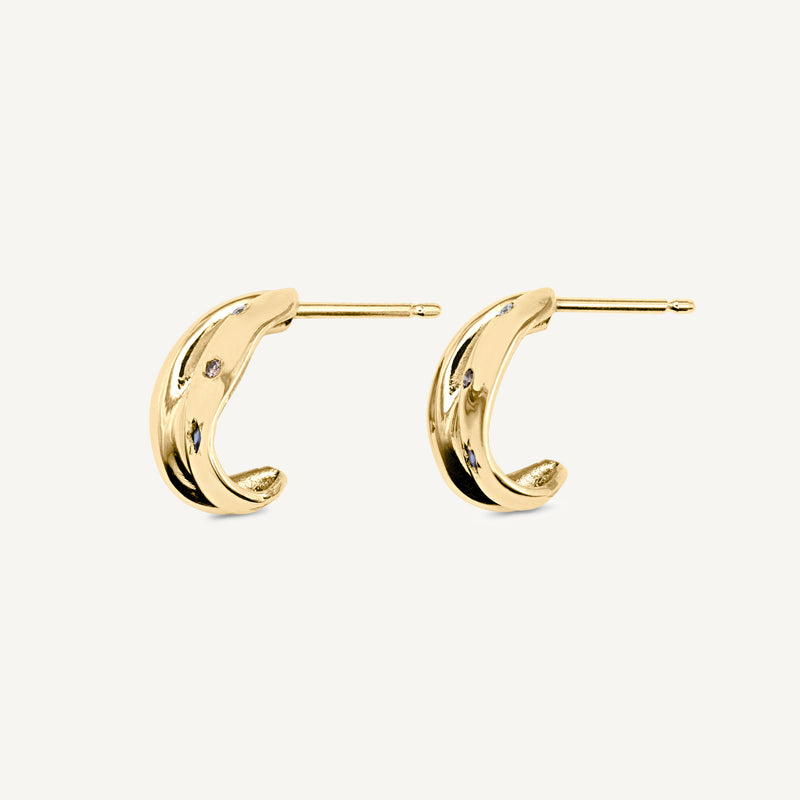 Folded solid 14ct yellow gold diamond hoop earrings set with diamonds, sapphires and tourmaline gemstones. Handmade in South London using 100% recycled gold and ethically sourced gemstones.