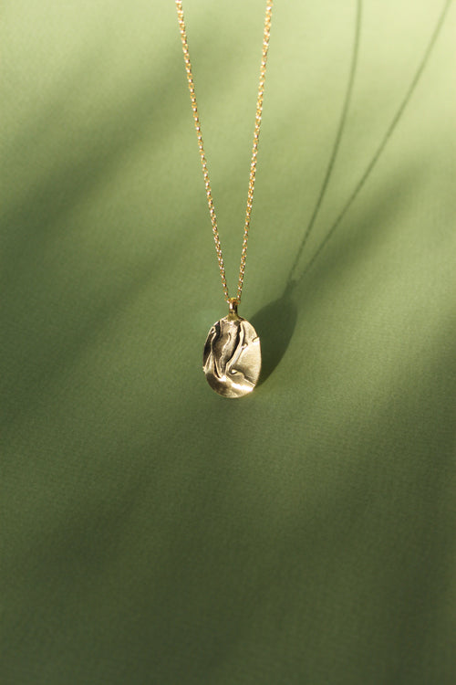 Bespoke Henrik Necklace with a custom imprint of the client's lino prints. Handmade in London using recycled silver and plated in 18ct yellow gold.