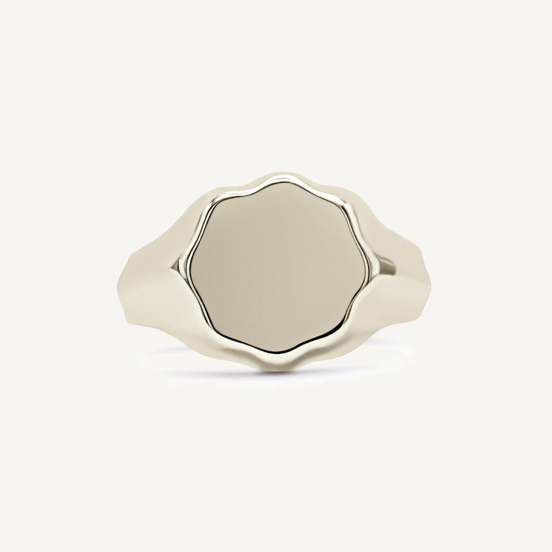 Floral flower signet ring made from solid 14ct yellow gold. Customisable with engraving or adding gemstones. Handmade in South London using 100% recycled precious metal.