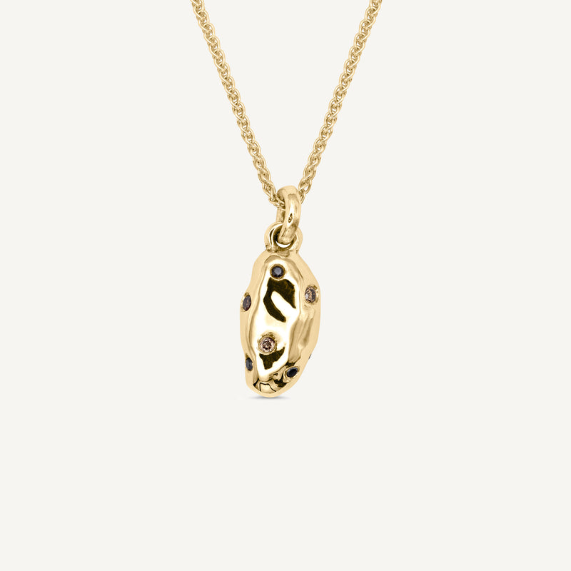 Luxurious champagne and black diamonds set into a solid 14ct yellow gold potato charm which elegantly hangs from a dainty 14ct gold 18 inch chain necklace. Handmade in South London using 100% recyled gold and ethically sourced gemstones.