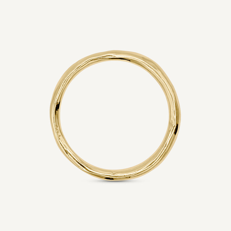 A subtle textured thin wedding ring is handmade from 100% recycled solid 14ct yellow gold, a timeless wedding ring choice. Made by South London jeweller Robyn Smith