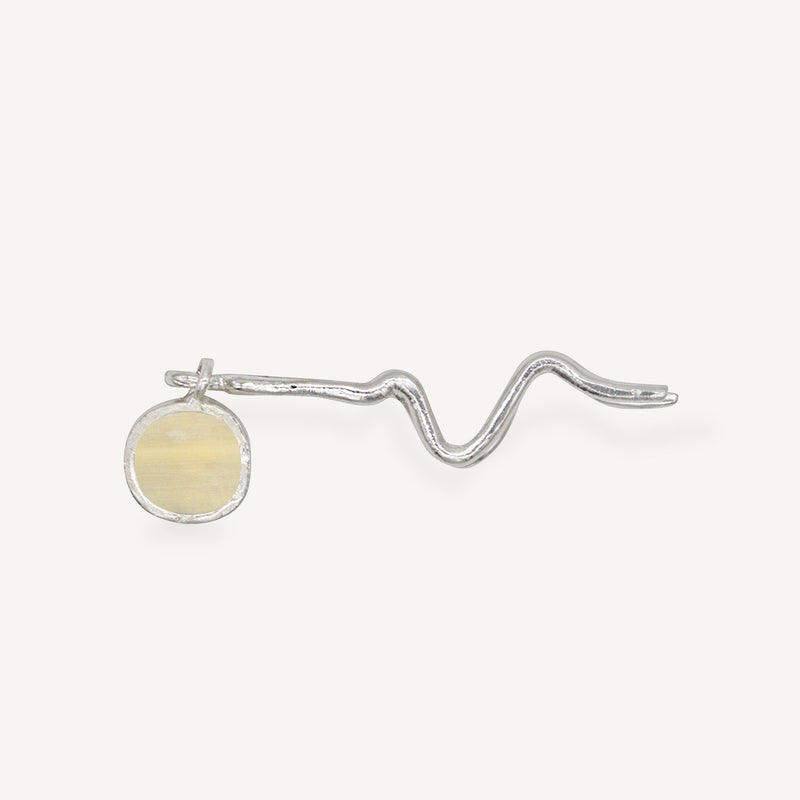 These statement recycled silver hair slides feature organic texture and a disc of ethically sourced highland horn, all ethically handmade in London by Folde Jewellery.