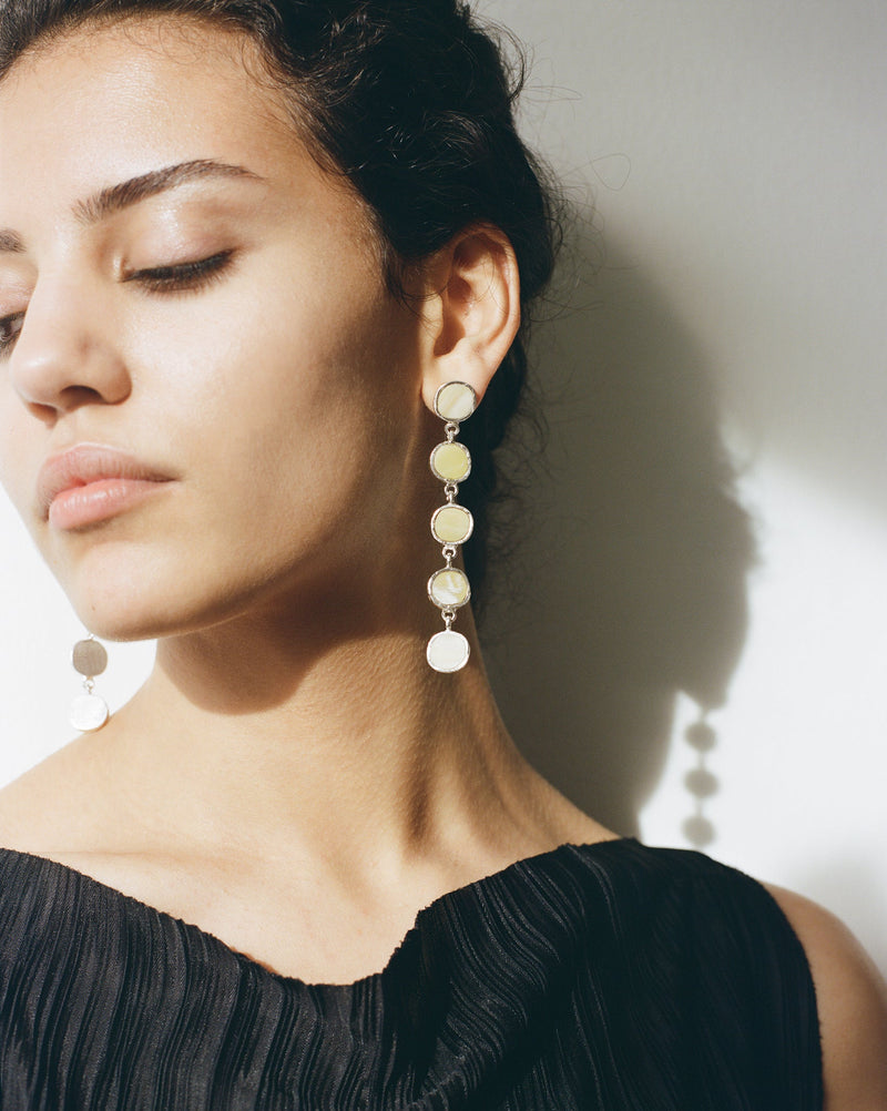 Sculptural statement silver drop earrings handcrafted by Robyn Smith for Folde Jewellery in London ethically handmade using recycled silver and highland horn.