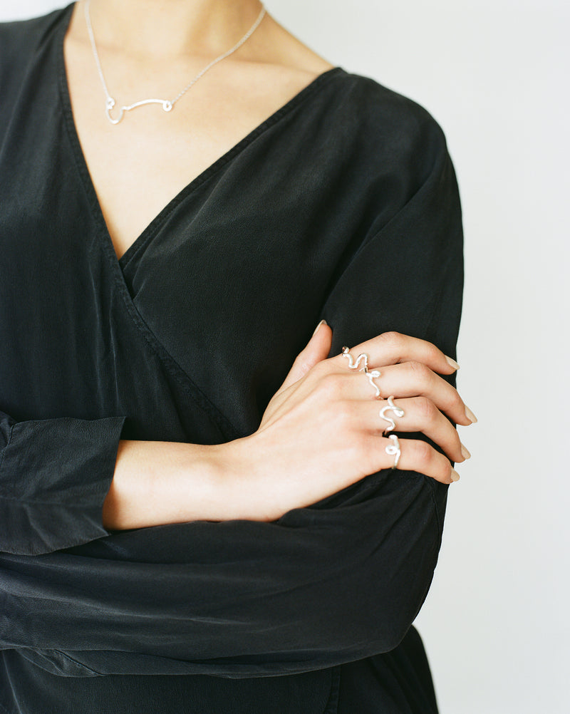 Emory ring Playful silver line drawing stacking ring with organic textured silver finish ethically handmade in London from recycled silver by Robyn Smith for Folde Jewellery