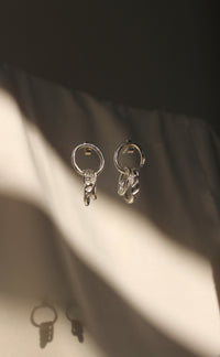 Bespoke Drop Earrings printed with the soles of school gym shoes. Handmade in London using recycled silver.