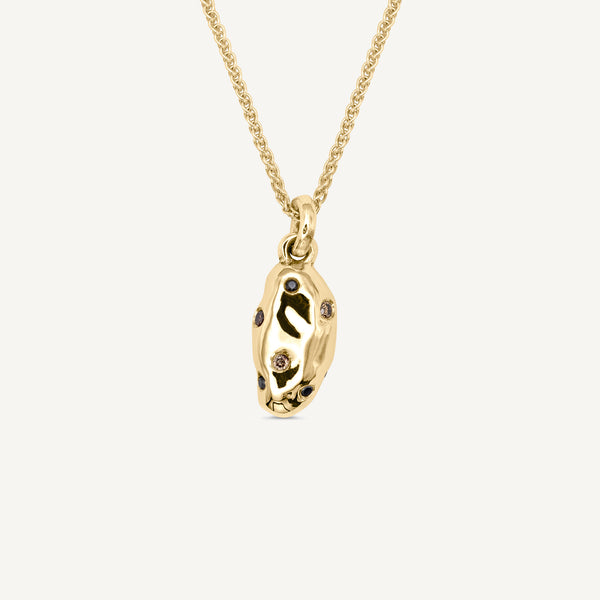 Luxurious champagne and black diamonds set into a solid 14ct yellow gold potato charm which elegantly hangs from a dainty 14ct gold 18 inch chain necklace. Handmade in South London using 100% recyled gold and ethically sourced gemstones.