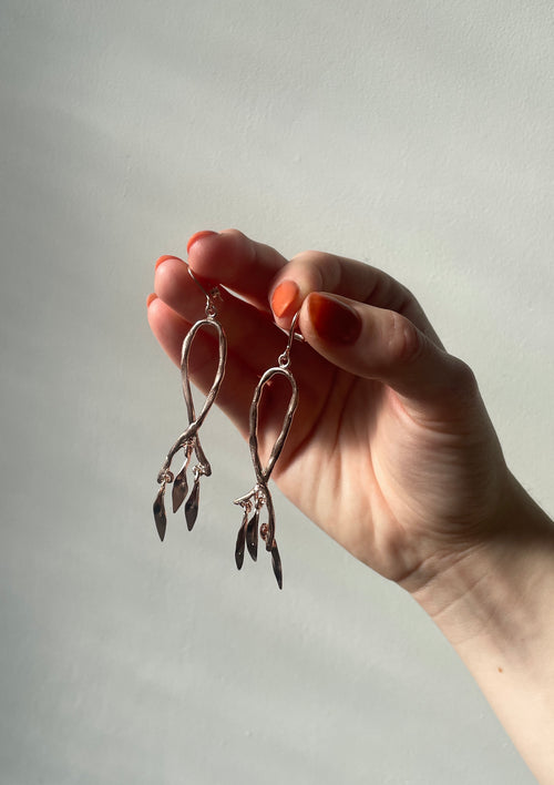 Bespoke Feathered earrings in rose gold inspired by artefacts and ancient antique jewellery | Womens and Mens bespoke jewellery available in 9ct, 14ct, 18ct gold and platinum | Crafted from 100% recycled metals in south London with the philosophy that roughness and refinement can coexist