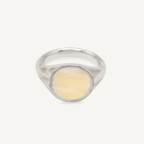 The RAY ring is a chunky silver and horn signet ring with organic textured silver finish ethically handmade in London from recycled silver by Robyn Smith for Folde Jewellery