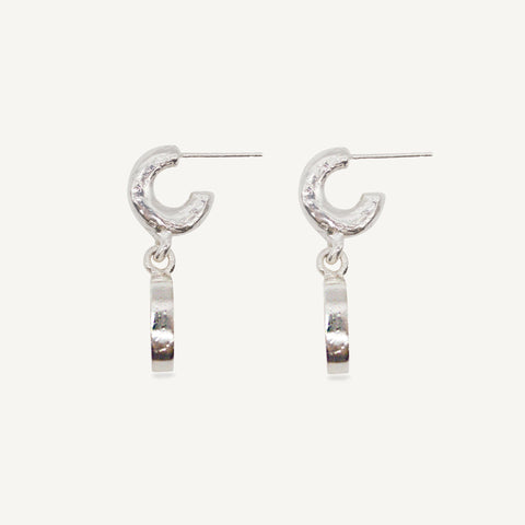 Sculptural statement silver hoop earrings handcrafted by Robyn Smith for Folde Jewellery in London ethically handmade using recycled silver and highland horn.